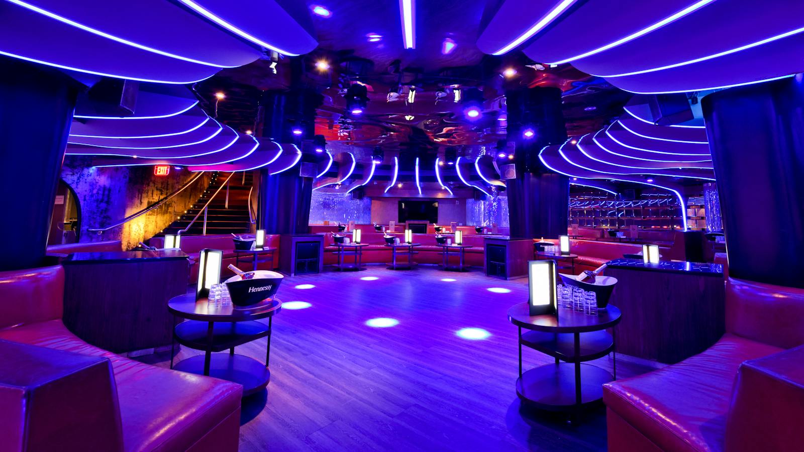 Booths under the sculpted light ceiling. Authentic Strand venue photograph from its official gallery.
